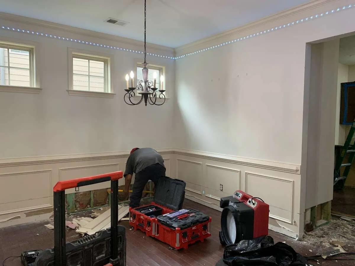 Restoration technician with professional equipment in Wilton